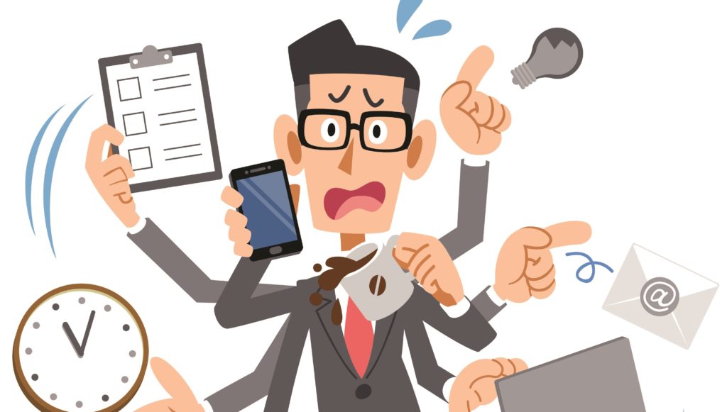 man met teveel taken tegelijk en werkstress